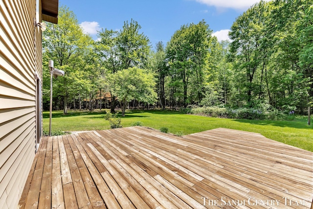 7120 Quarterline Rd, Spring Lake, MI 49456 - wooden terrace with a lawn and view of scattered trees