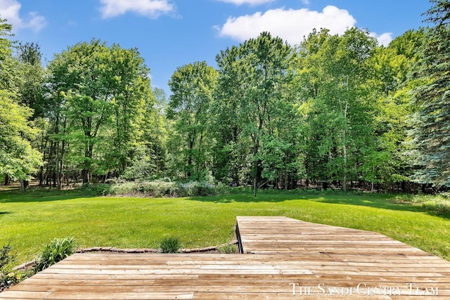 7120 Quarterline Rd, Spring Lake, MI 49456 - wooden deck with a lawn