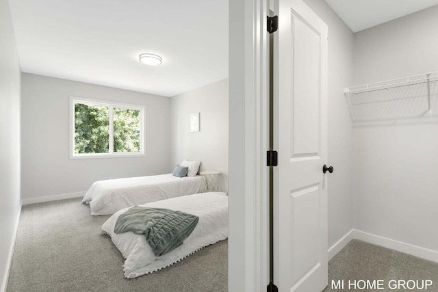 13654 Signature Dr, Holland, MI 49424 - bedroom with carpet floors and baseboards