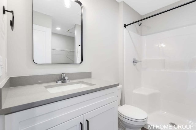 13654 Signature Dr, Holland, MI 49424 - bathroom with vanity, toilet, and a shower