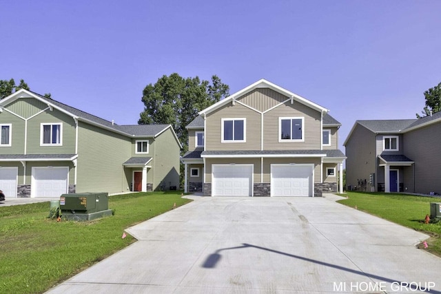 13654 Signature Dr, Holland, MI 49424 - view of front of house featuring a garage, driveway, stone siding, and a front lawn
