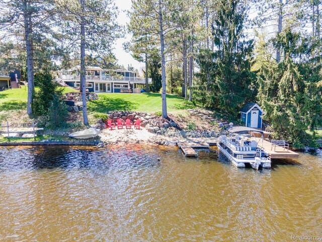 900 Indianwood Rd, Lake Orion, MI 48362 - dock area featuring a lawn and a water view
