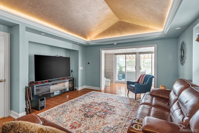 900 Indianwood Rd, Lake Orion, MI 48362 - living area with a tray ceiling, baseboards, and wood finished floors