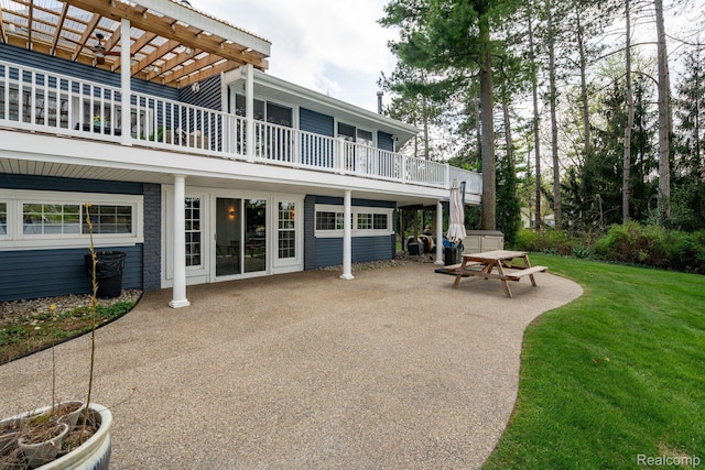 900 Indianwood Rd, Lake Orion, MI 48362 - rear view of house with a patio, a lawn, a balcony, and a pergola