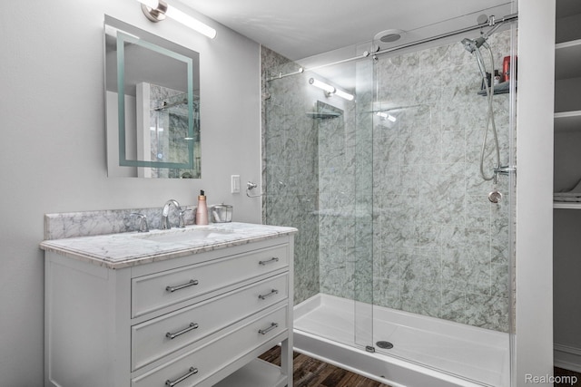 900 Indianwood Rd, Lake Orion, MI 48362 - full bathroom with a stall shower, vanity, and wood finished floors