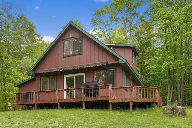 3284 N Flynn Rd, Luther, MI 49656 - rear view of property featuring a wooden deck and a yard