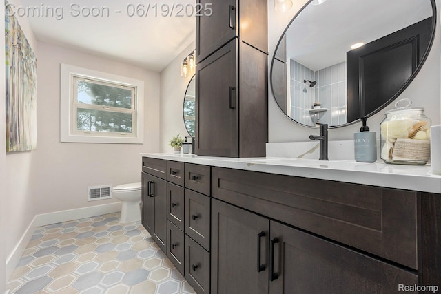 54232 Mound Rd, Shelby Twp, MI 48316 - bathroom featuring double vanity, a shower, and tile patterned floors