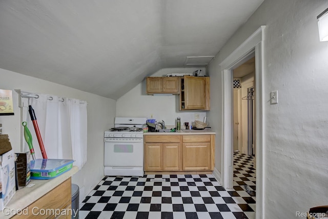 338 W Parent Ave, Royal Oak, MI 48067 - kitchen featuring white range with gas stovetop, tile patterned floors, light countertops, vaulted ceiling, and a sink