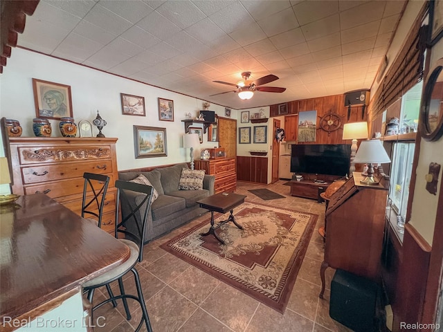 33200 Raphael Rd, Farmington, MI 48336 - living room with tile patterned floors, ceiling fan, and wood walls