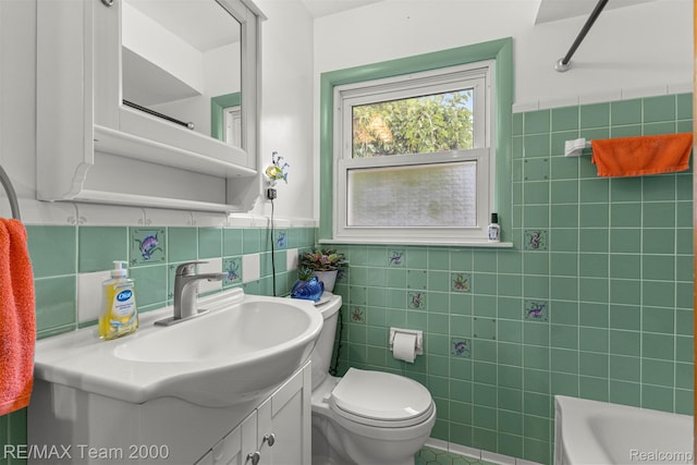 18155 Audette St, Dearborn, MI 48124 - full bath with tile walls, vanity, a tub, toilet, and wainscoting