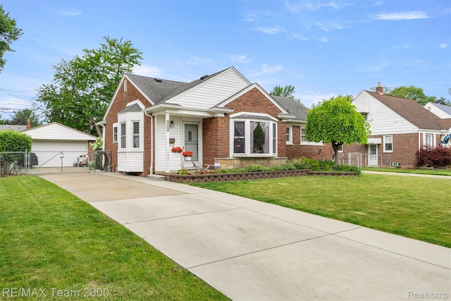 18155 Audette St, Dearborn, MI 48124 - bungalow featuring brick siding, an outdoor structure, a detached garage, and a shingled roof