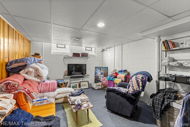 18155 Audette St, Dearborn, MI 48124 - carpeted living room with concrete block wall and a drop ceiling