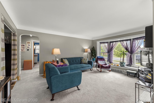 18155 Audette St, Dearborn, MI 48124 - living room featuring arched walkways and carpet flooring