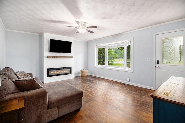 46915 Anthony St, Paw Paw, MI 49079 - living room featuring ceiling fan, baseboards, a large fireplace, dark wood finished floors, and crown molding