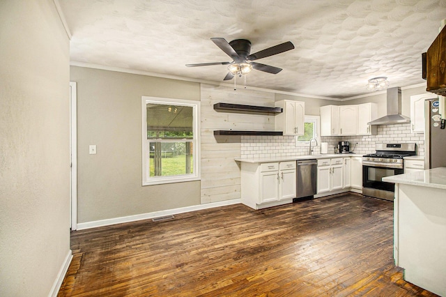 46915 Anthony St, Paw Paw, MI 49079 - kitchen with wall chimney exhaust hood, appliances with stainless steel finishes, light countertops, decorative backsplash, and white cabinetry