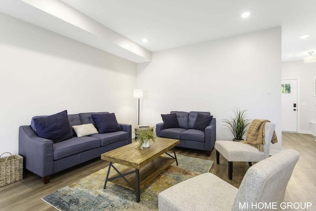 13652 Signature Dr, Holland, MI 49424 - living room featuring wood finished floors, recessed lighting, and baseboards