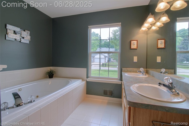 18594 Lawrence Ln, New Boston, MI 48164 - bathroom featuring tile patterned floors, double vanity, and a tub with jets