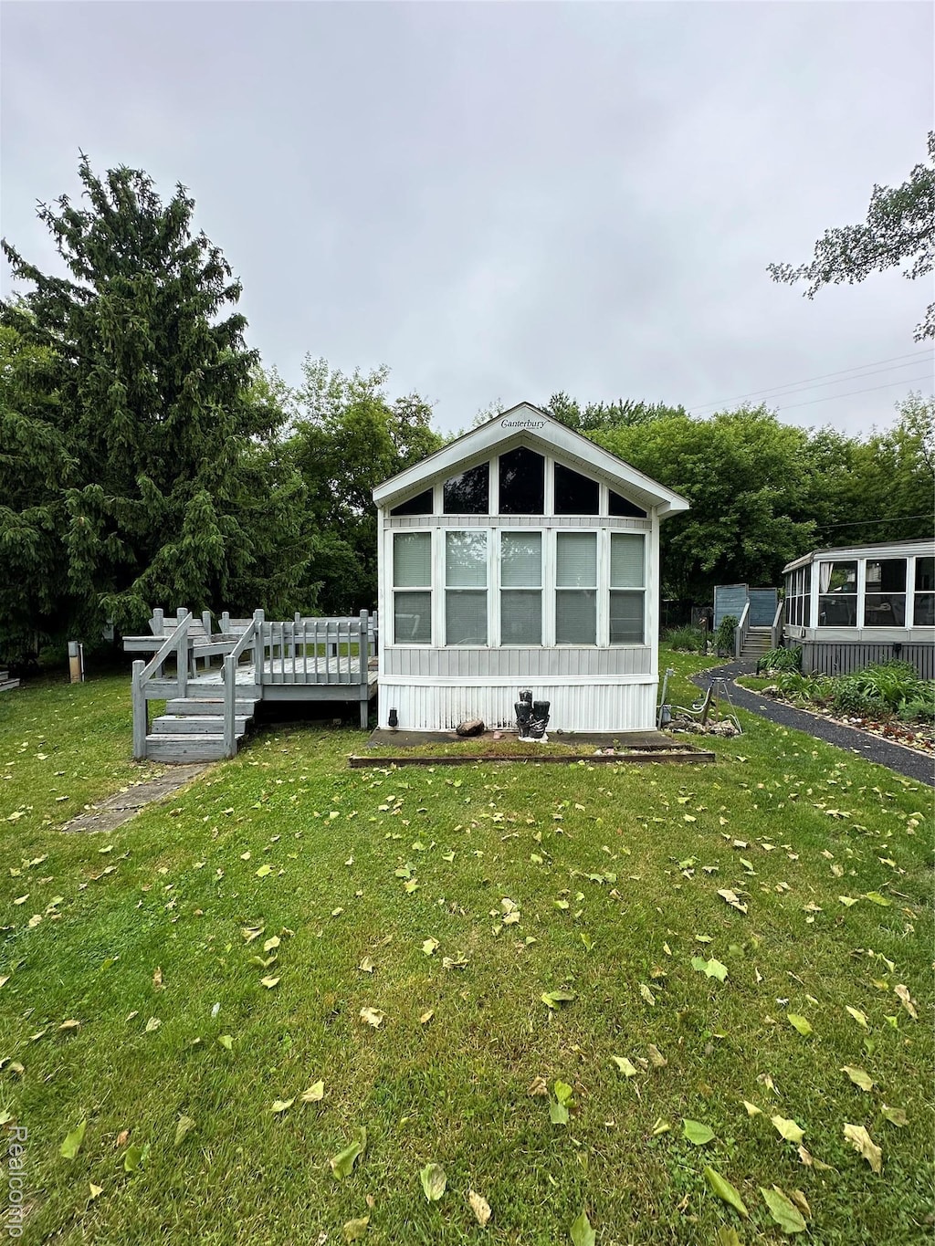10001 Goodall Rd Unit 30, Durand, MI 48429 - view of side of home featuring a lawn