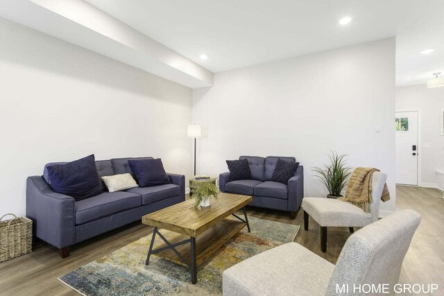 13656 Signature Dr, Holland, MI 49424 - living room featuring wood finished floors, recessed lighting, and baseboards
