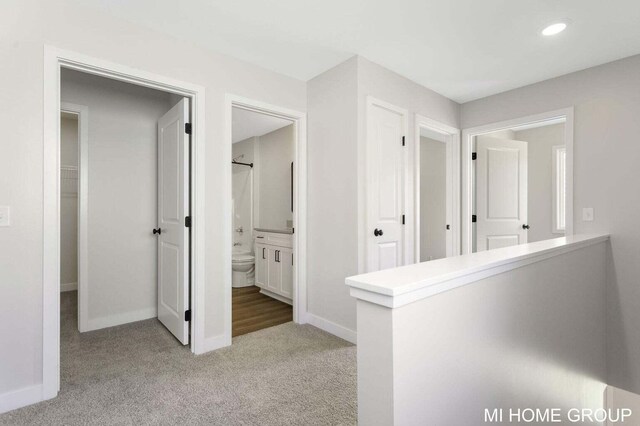 13656 Signature Dr, Holland, MI 49424 - corridor with carpet flooring, baseboards, and recessed lighting