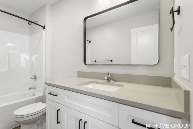 13656 Signature Dr, Holland, MI 49424 - bathroom featuring toilet, vanity, and washtub / shower combination