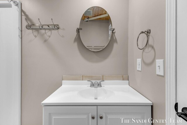6372 Lake Harbor Rd, Norton Shores, MI 49441 - bathroom with vanity