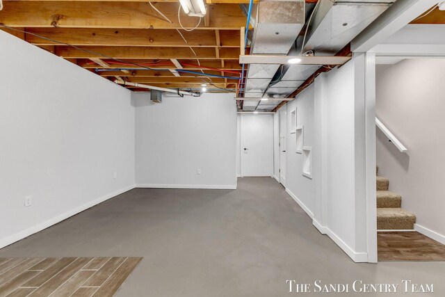 6372 Lake Harbor Rd, Norton Shores, MI 49441 - finished basement featuring baseboards and stairs