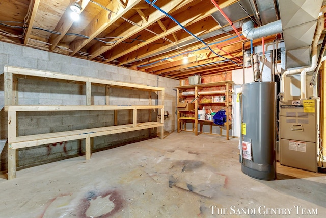 6372 Lake Harbor Rd, Norton Shores, MI 49441 - unfinished basement featuring water heater and heating unit