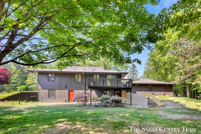 6372 Lake Harbor Rd, Norton Shores, MI 49441 - rear view of house featuring a wooden deck, a yard, and stairs