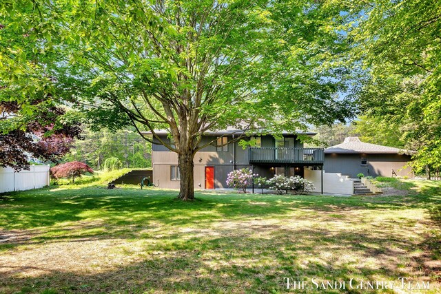 6372 Lake Harbor Rd, Norton Shores, MI 49441 - view of yard featuring a deck