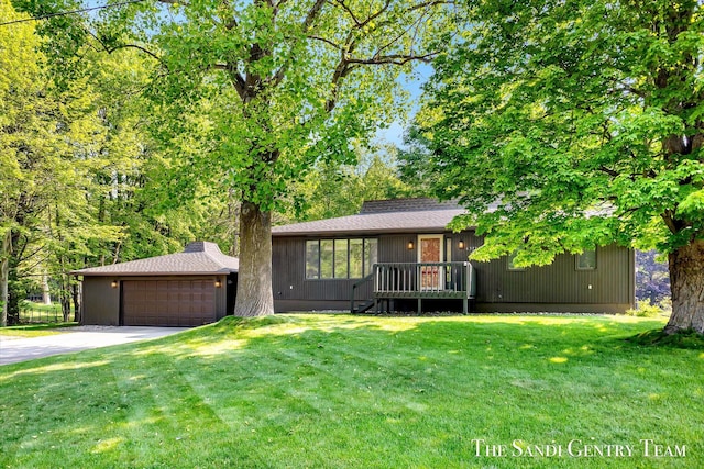 6372 Lake Harbor Rd, Norton Shores, MI 49441 - view of front of home with a front yard, a chimney, and driveway