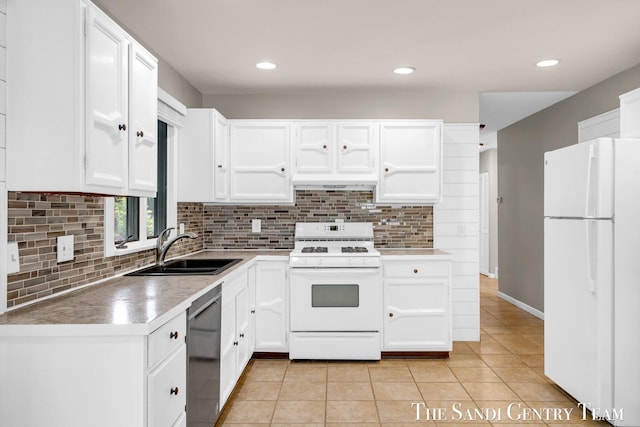 6372 Lake Harbor Rd, Norton Shores, MI 49441 - kitchen with white appliances, a sink, tasteful backsplash, light tile patterned floors, and white cabinetry