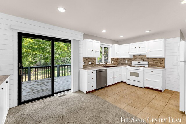 6372 Lake Harbor Rd, Norton Shores, MI 49441 - kitchen featuring white gas range oven, dishwasher, a sink, tasteful backsplash, and recessed lighting