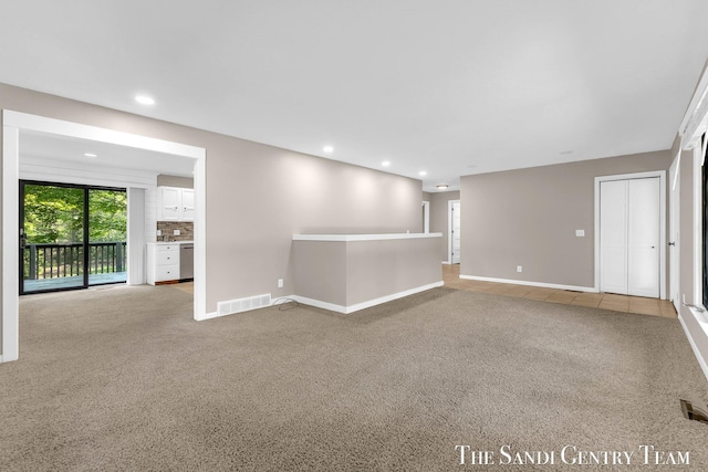 6372 Lake Harbor Rd, Norton Shores, MI 49441 - carpeted empty room featuring baseboards and recessed lighting