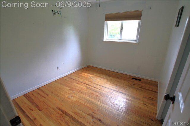 6325 Clarkston Rd, Clarkston, MI 48346 - empty room featuring light wood-type flooring and baseboards
