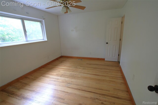 6325 Clarkston Rd, Clarkston, MI 48346 - spare room with light wood-type flooring, a ceiling fan, and baseboards