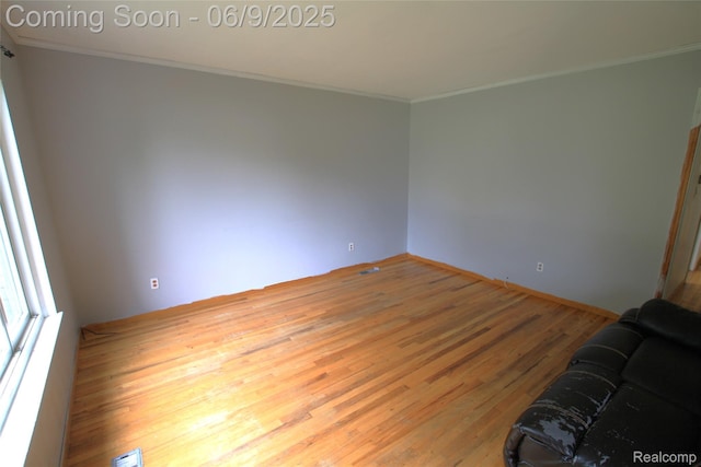 6325 Clarkston Rd, Clarkston, MI 48346 - empty room featuring ornamental molding and wood finished floors