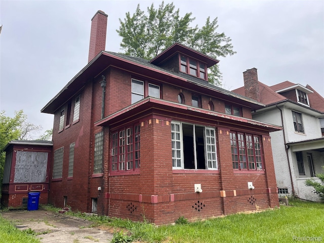 728 Lawrence St, Detroit, MI 48202 - view of side of property featuring brick siding and a chimney