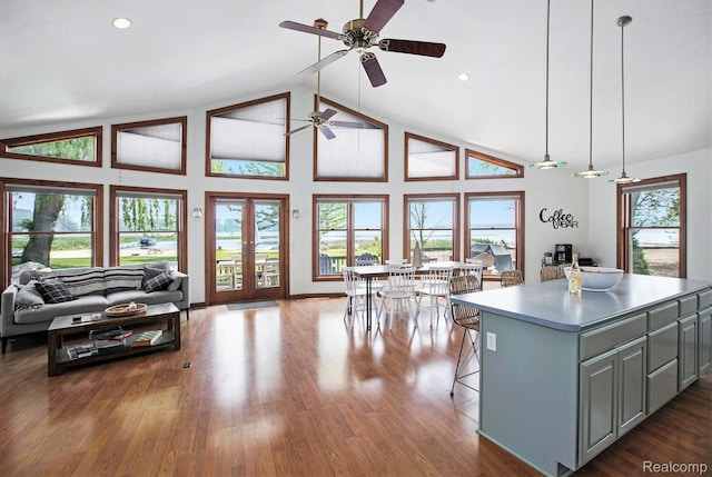 8721 Bayview Rd, Onekama, MI 49675 - kitchen featuring gray cabinetry, ceiling fan, open floor plan, a kitchen island, and wood finished floors