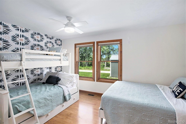 8721 Bayview Rd, Onekama, MI 49675 - bedroom featuring wood finished floors and a ceiling fan