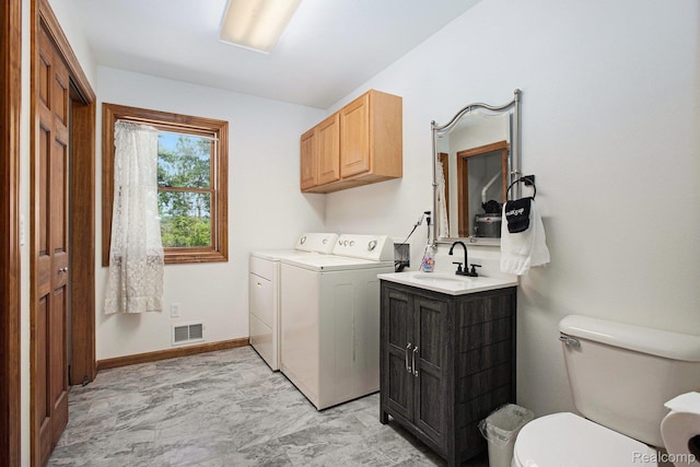 8721 Bayview Rd, Onekama, MI 49675 - laundry room featuring separate washer and dryer and light marble finish flooring