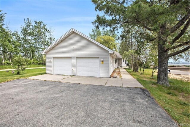 8721 Bayview Rd, Onekama, MI 49675 - garage featuring asphalt driveway