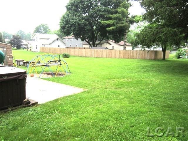 311 Tiffin St, Hudson, MI 49247 - view of yard with a patio area and a hot tub