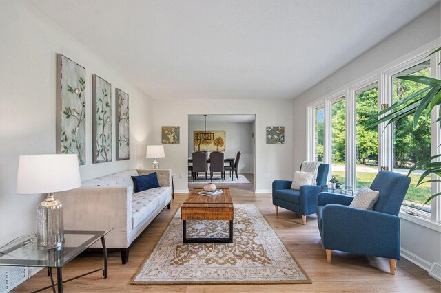 15878 New Holland St, Holland, MI 49424 - living area featuring light wood-style floors and baseboards