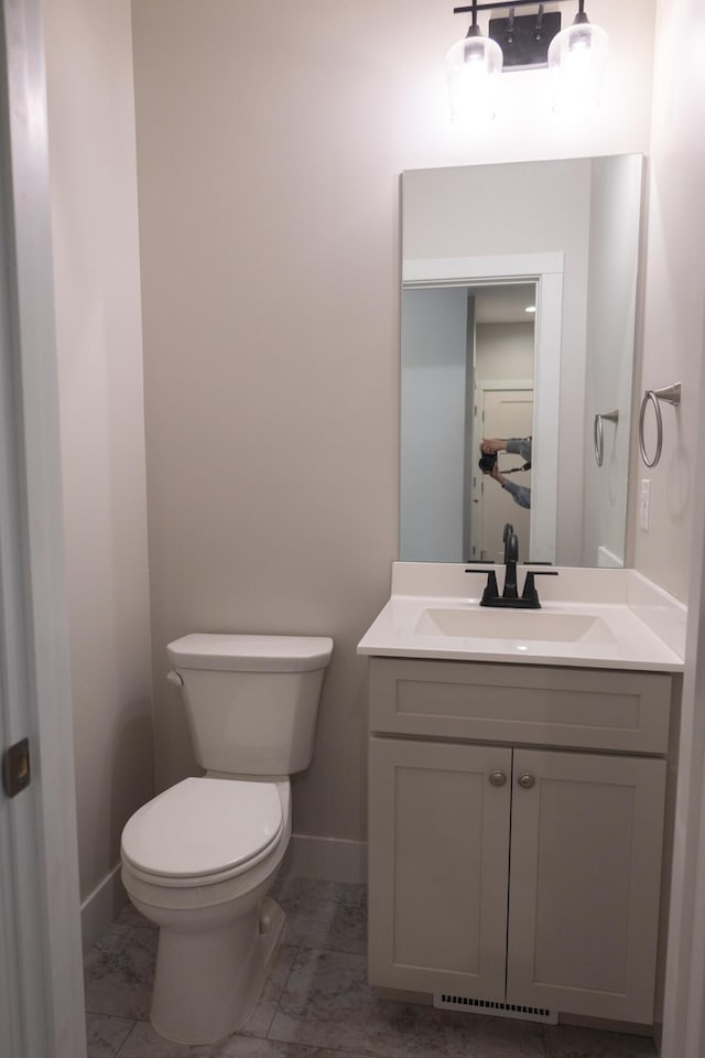 103 Diamond Point Ln, New Buffalo, MI 49117 - half bathroom featuring toilet, vanity, and baseboards