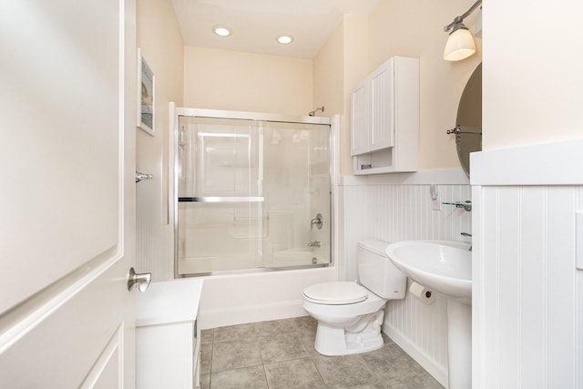 23 Kenneth St, Pentwater, MI 49449 - full bath with toilet, combined bath / shower with glass door, and tile patterned floors