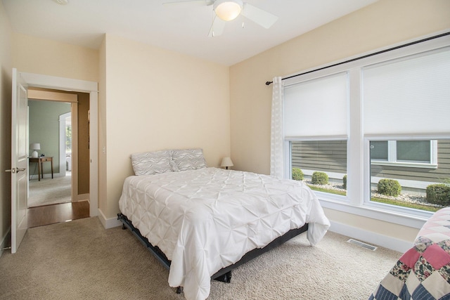 23 Kenneth St, Pentwater, MI 49449 - carpeted bedroom with baseboards and a ceiling fan