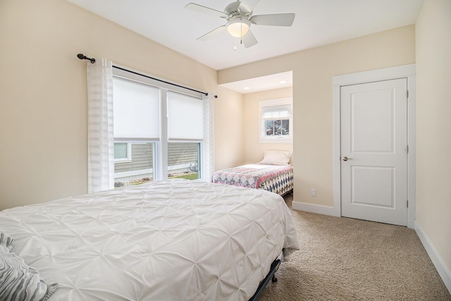 23 Kenneth St, Pentwater, MI 49449 - bedroom with carpet, baseboards, and a ceiling fan
