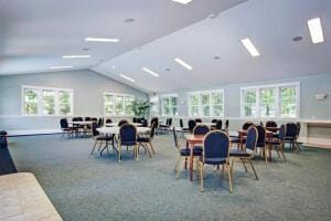 23 Kenneth St, Pentwater, MI 49449 - carpeted dining room with vaulted ceiling