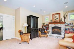 23 Kenneth St, Pentwater, MI 49449 - sitting room with a fireplace, recessed lighting, carpet, and baseboards